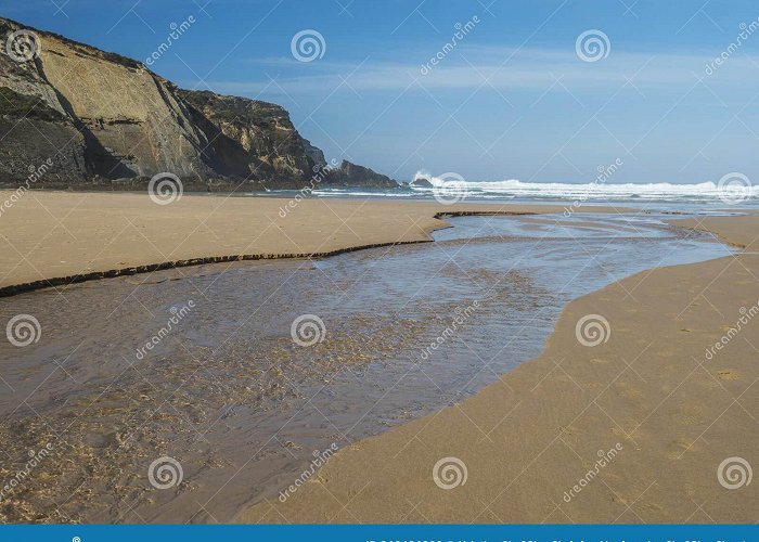 Praia de Carvalhal View of Empty Praia Do Carvalhal Beach with Small Stream Leading ... photo