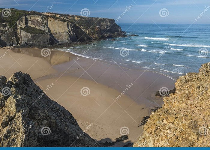 Praia de Carvalhal View of Empty Praia Do Carvalhal Beach with Ocean Waves, Cliffs ... photo